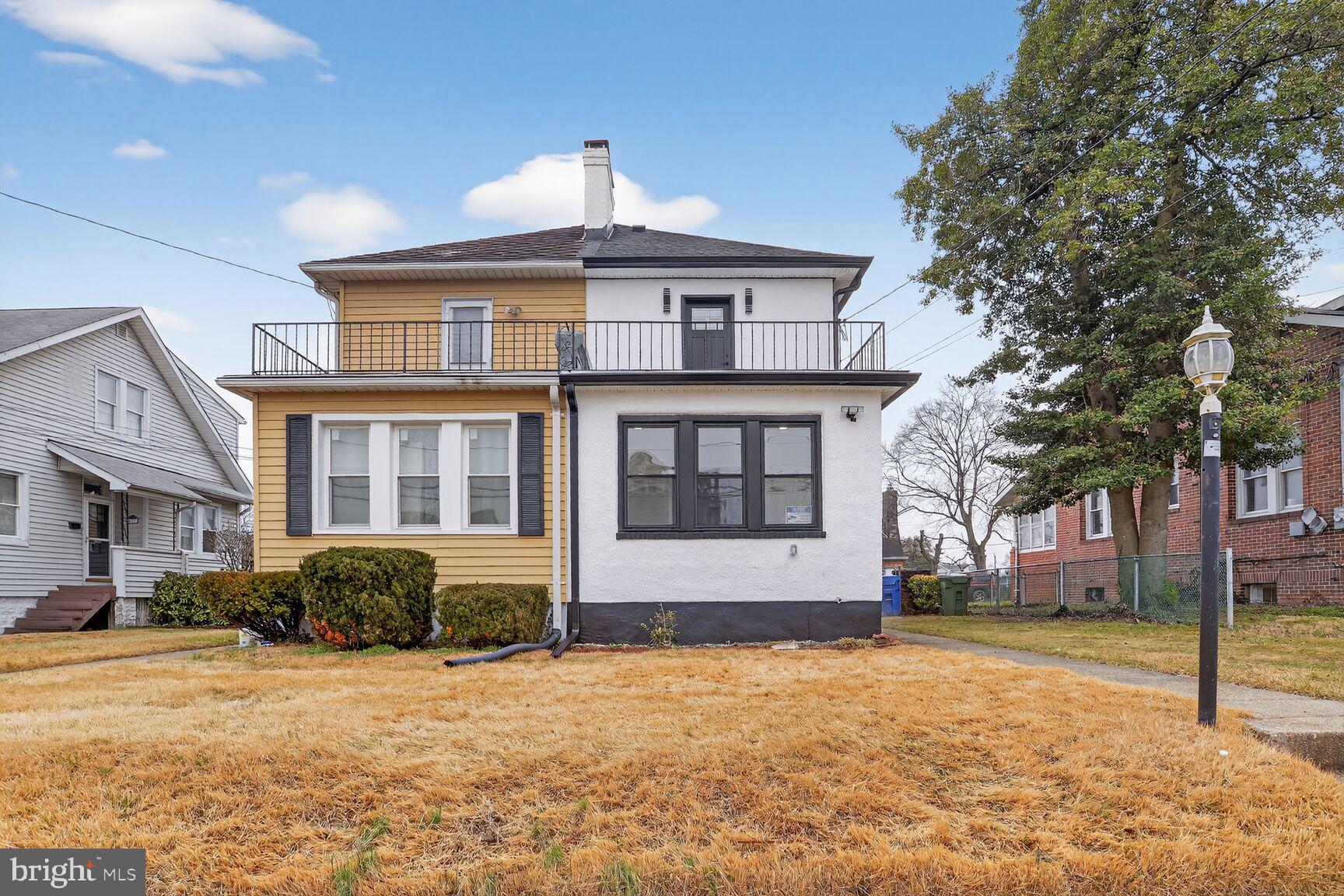 4013 4th Street Baltimore, MD 21225 - Photo 30 of 35 a front view of a house with a yard