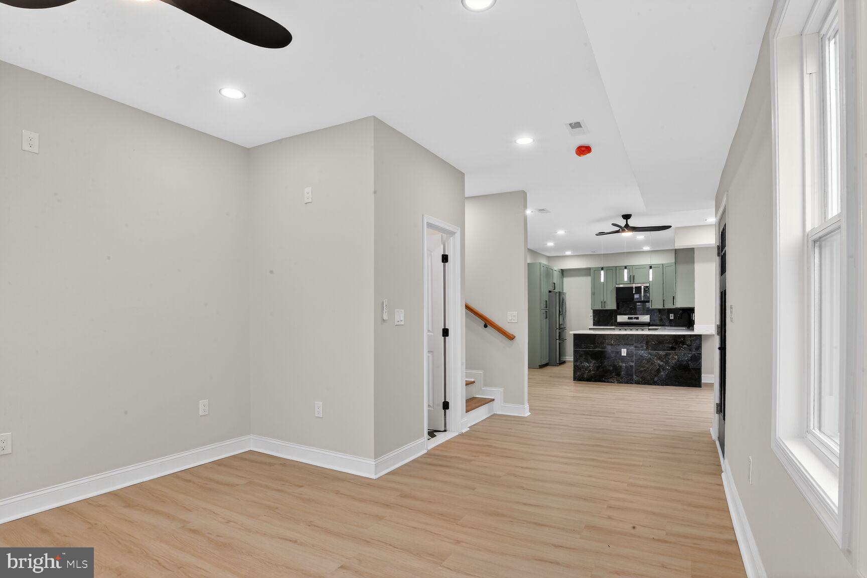 4013 4th Street Baltimore, MD 21225 - Photo 4 of 35 a kitchen with a refrigerator and a stove