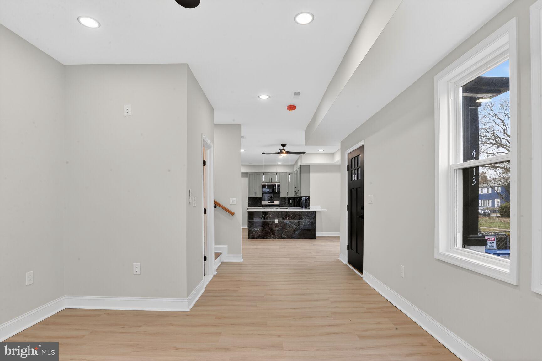 4013 4th Street Baltimore, MD 21225 - Photo 5 of 35 a view of a kitchen with a sink and a refrigerator