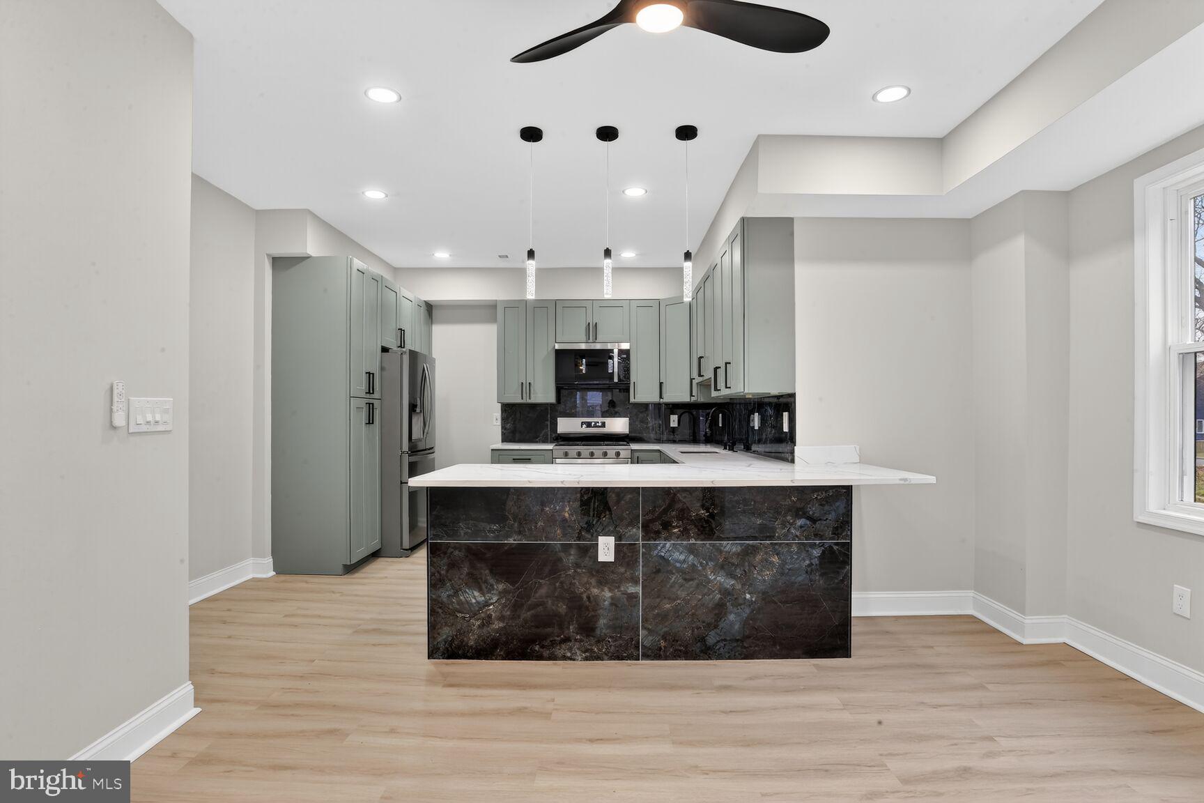 4013 4th Street Baltimore, MD 21225 - Photo 10 of 35 a view of kitchen and sink