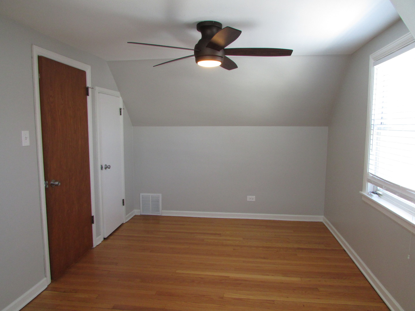 309 East Golf Road Des Plaines, IL 60016 - Photo 17 of 27 wooden floor in an empty room with a window