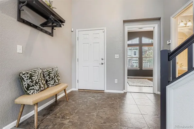 a living room with a couch and a walk in closet