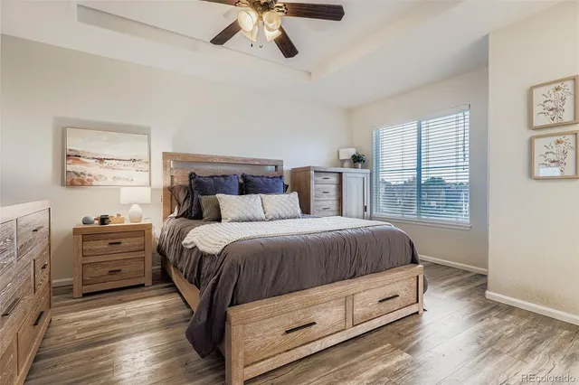 a spacious bedroom with a bed and a window