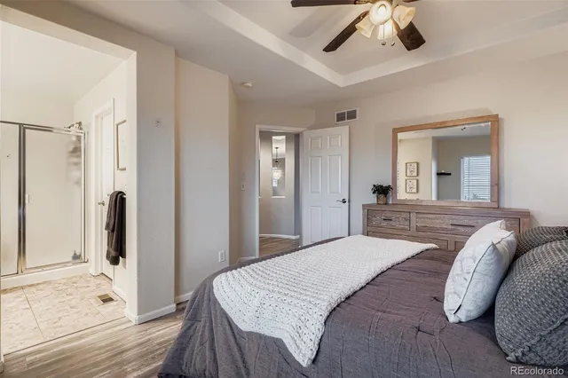 a bedroom with a bed and a mirror