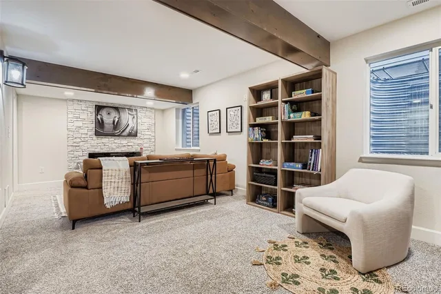 a living room with a couch and a bookshelf