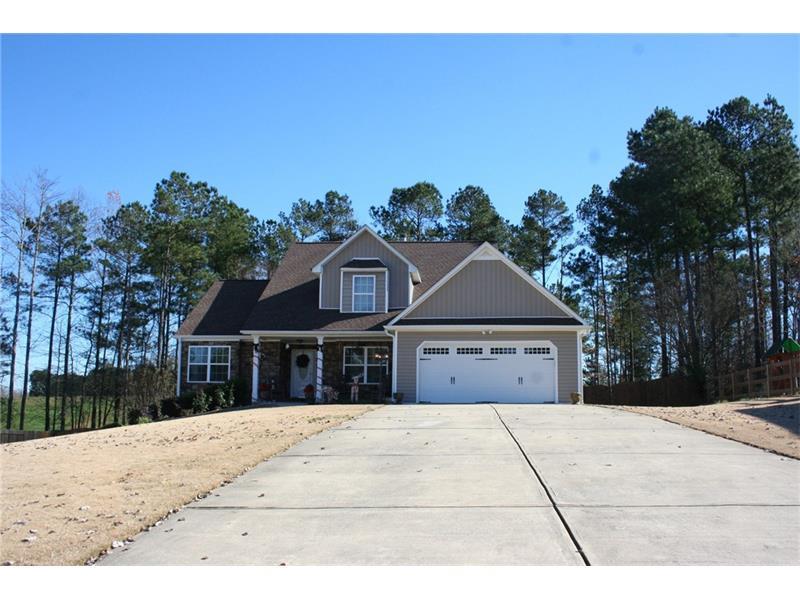 212 Muskogee Crossing Dallas, GA 30132 - Photo 1 of 1 View of extended driveway. Plenty of room for guests.