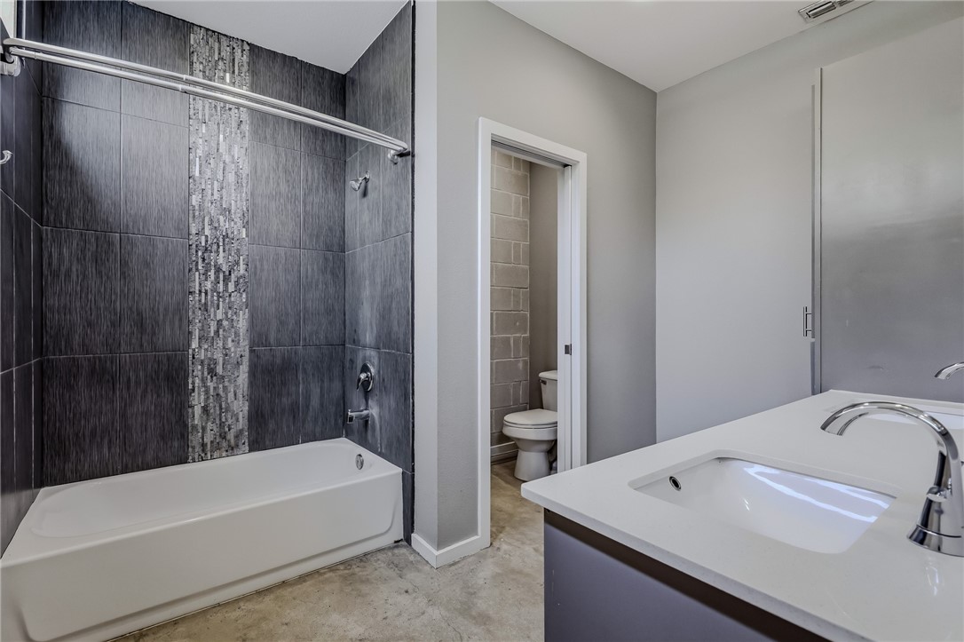 306 Easy Street, Unit B Corpus Christi, TX 78418 - Photo 11 of 24 a bathroom with a tub and a sink