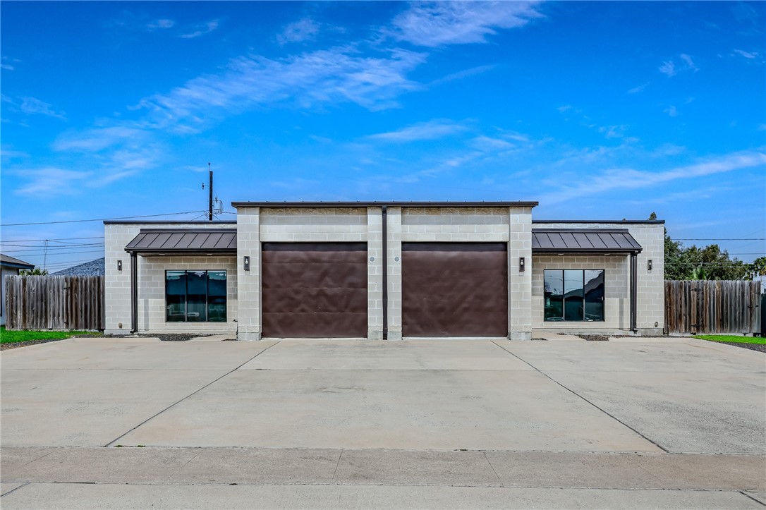 306 Easy Street, Unit B Corpus Christi, TX 78418 - Photo 2 of 24 front view of a house with a garage