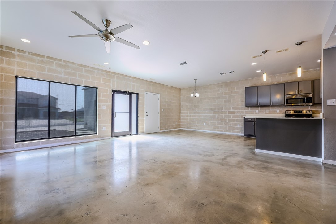 306 Easy Street, Unit B Corpus Christi, TX 78418 - Photo 4 of 24 a view of an empty room with a kitchen