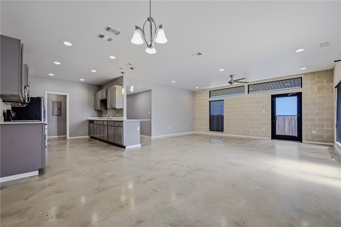 306 Easy Street, Unit B Corpus Christi, TX 78418 - Photo 5 of 24 a view of a kitchen with a sink and stainless steel appliances