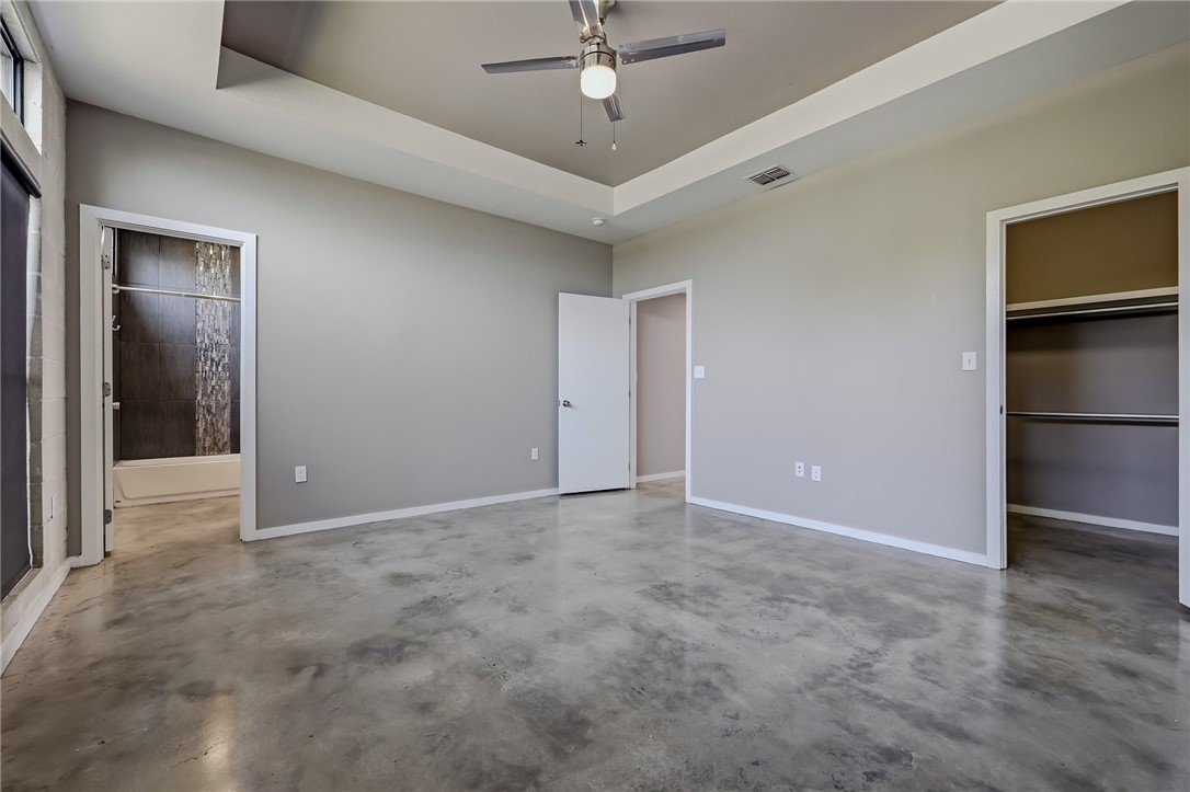 306 Easy Street, Unit B Corpus Christi, TX 78418 - Photo 9 of 24 an empty room with a ceiling fan