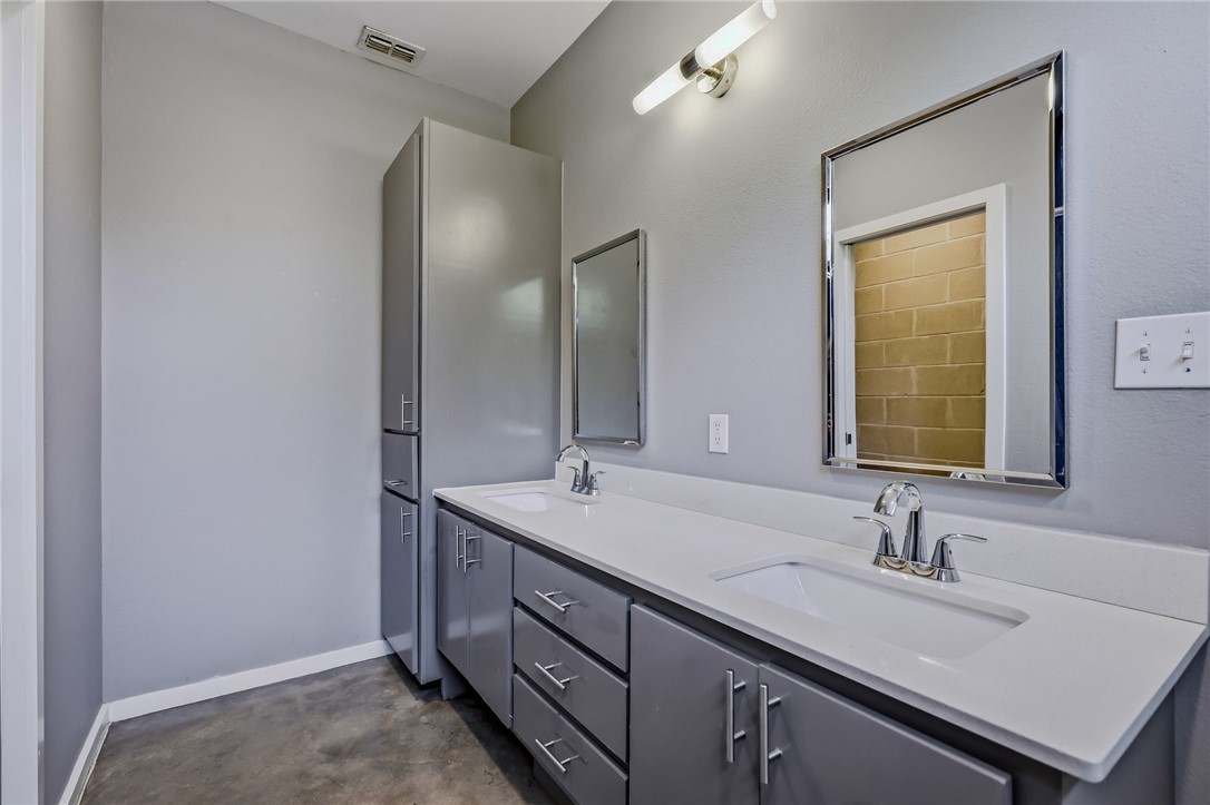 306 Easy Street, Unit B Corpus Christi, TX 78418 - Photo 10 of 24 a bathroom with a sink and a mirror