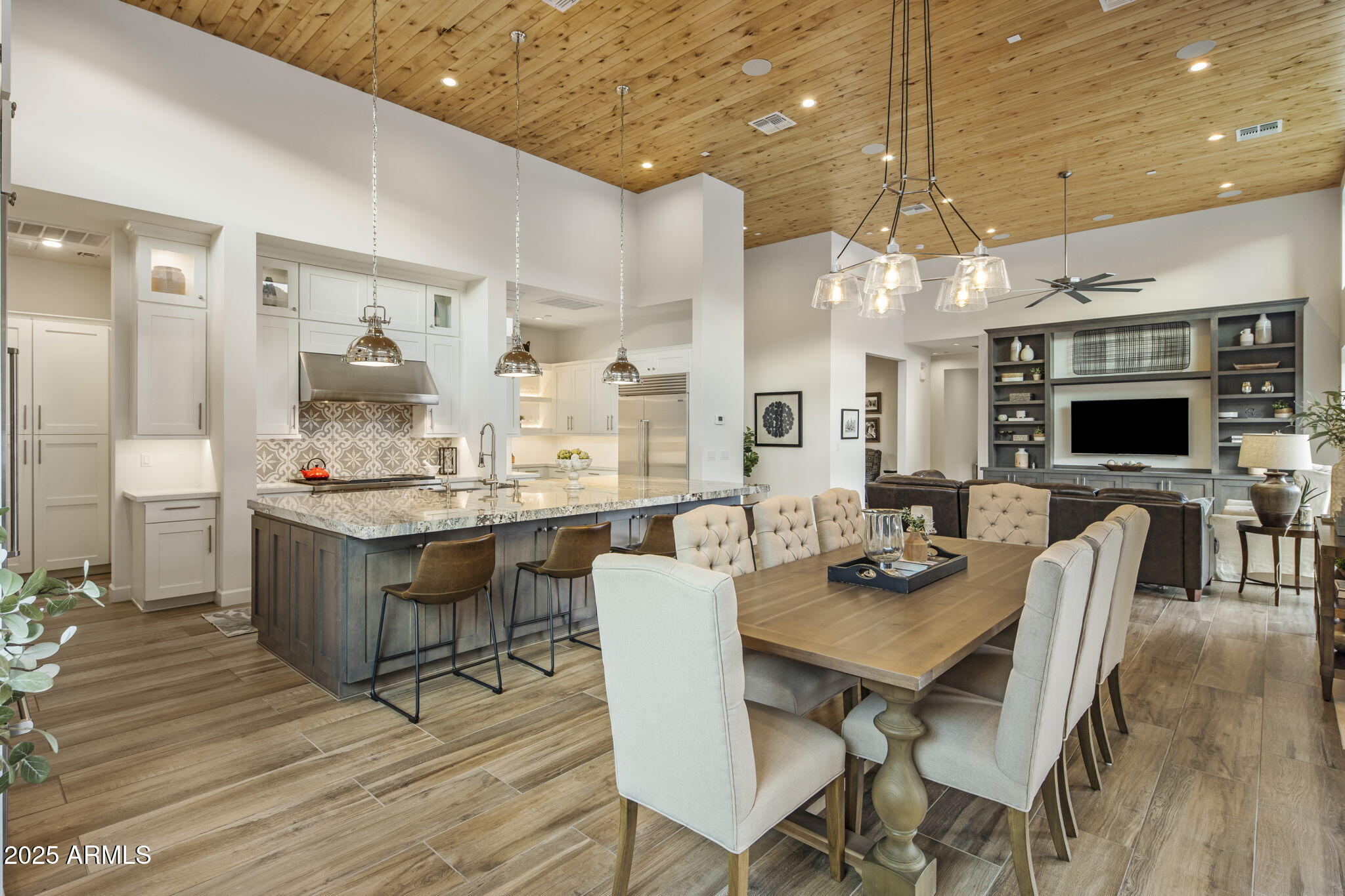 14122 Territory Trail Fountain Hills, AZ 85268 - Photo 12 of 46 a view of a dining room with furniture wooden floor and chandelier