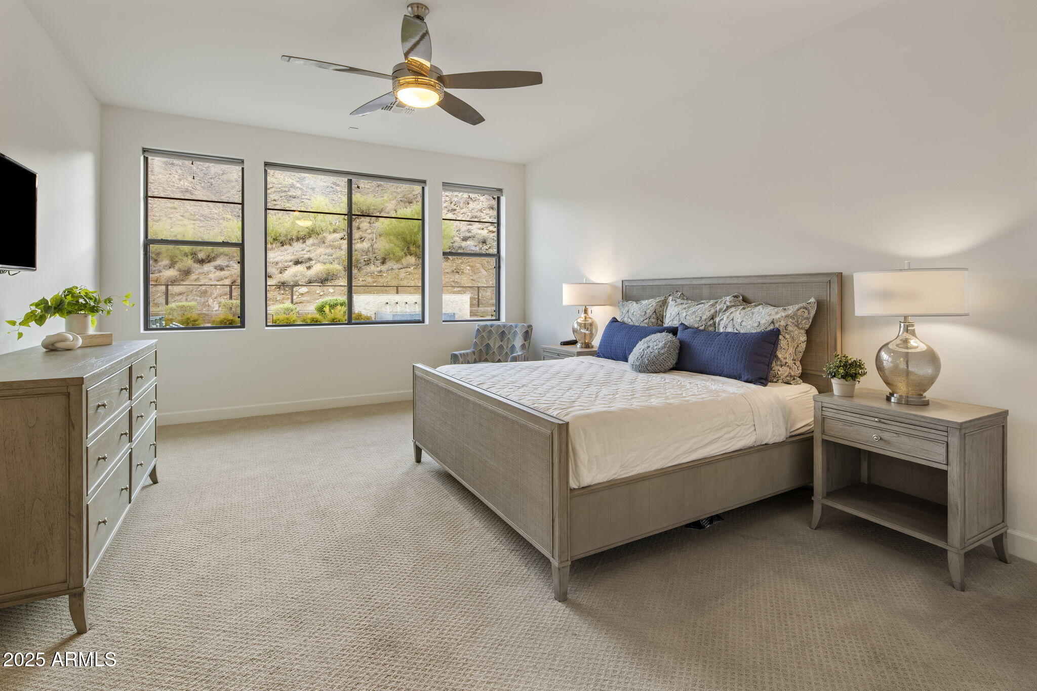 14122 Territory Trail Fountain Hills, AZ 85268 - Photo 21 of 46 a spacious bedroom with a bed and a chandelier