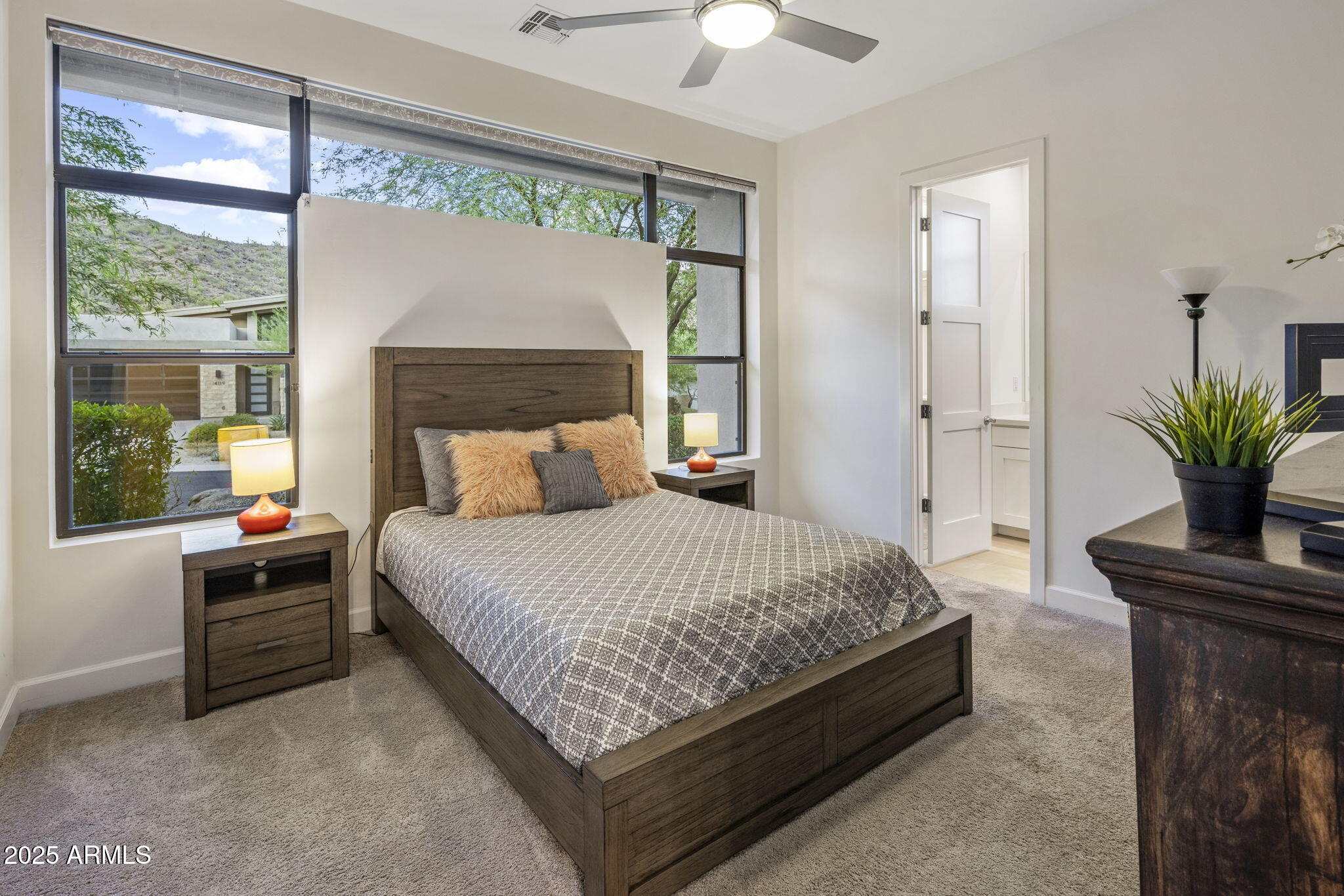 14122 Territory Trail Fountain Hills, AZ 85268 - Photo 27 of 46 a bedroom with a large bed and a potted plant
