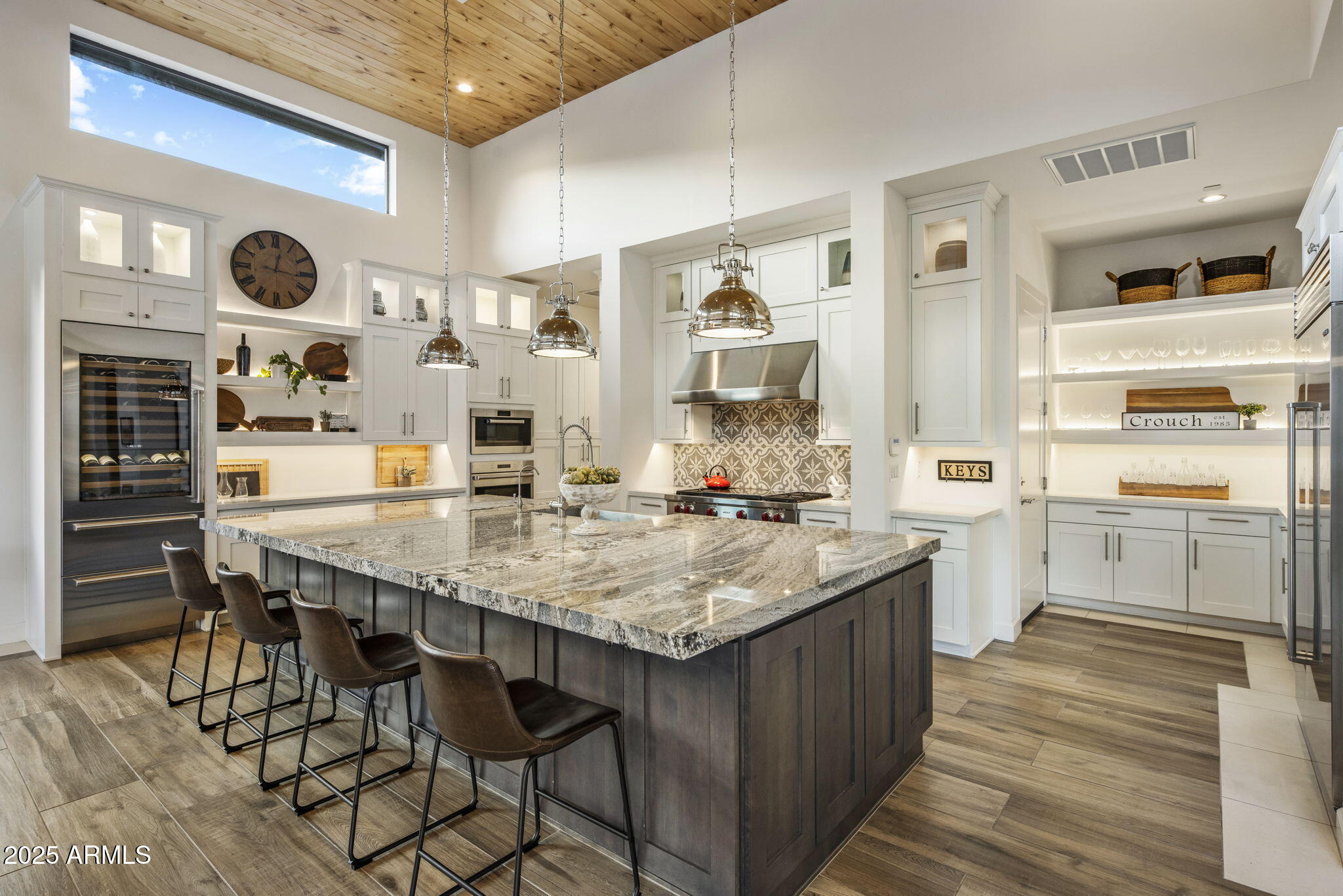 14122 Territory Trail Fountain Hills, AZ 85268 - Photo 3 of 46 a kitchen with cabinets and wooden floor
