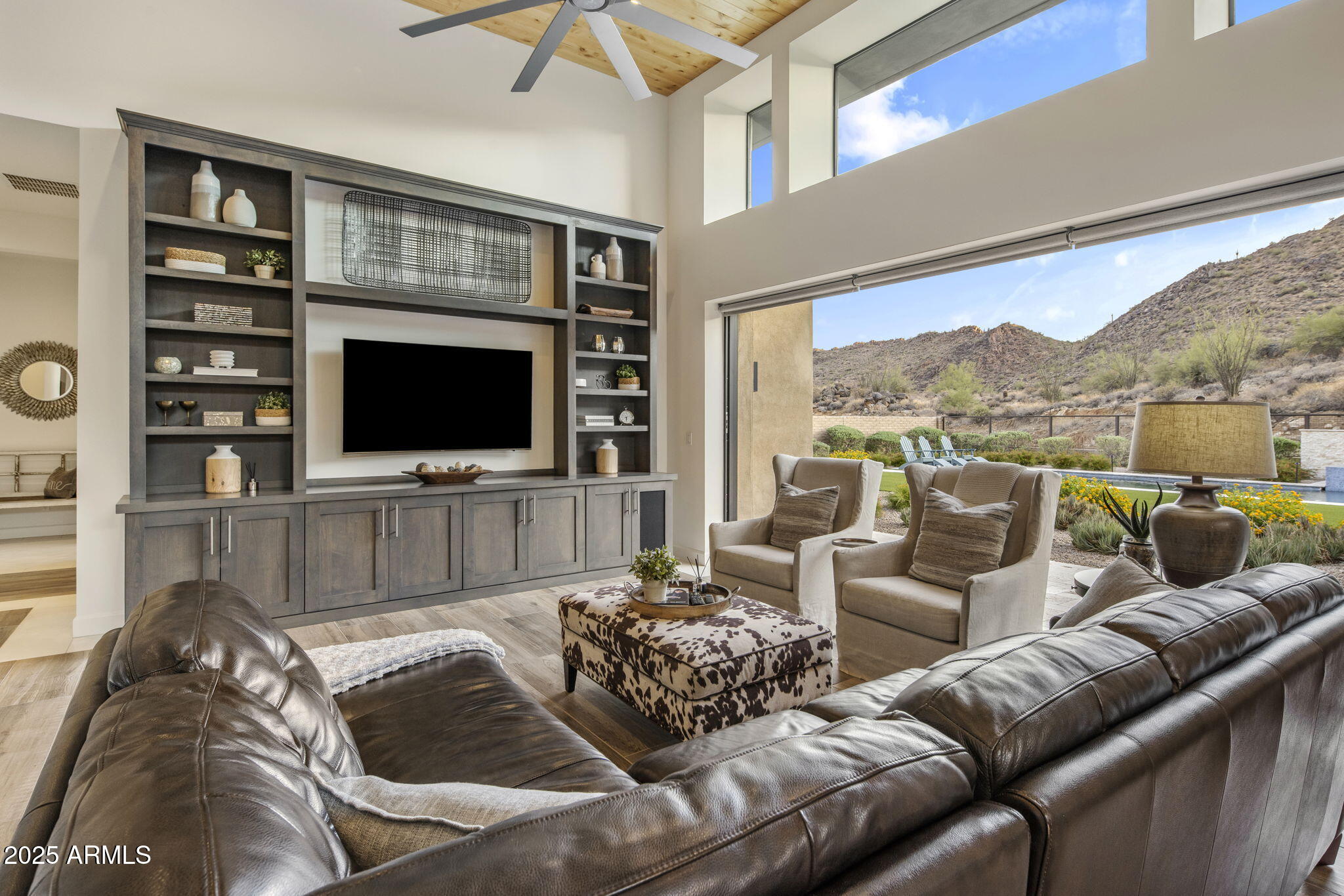 14122 Territory Trail Fountain Hills, AZ 85268 - Photo 4 of 46 a living room with furniture fireplace and a flat screen tv