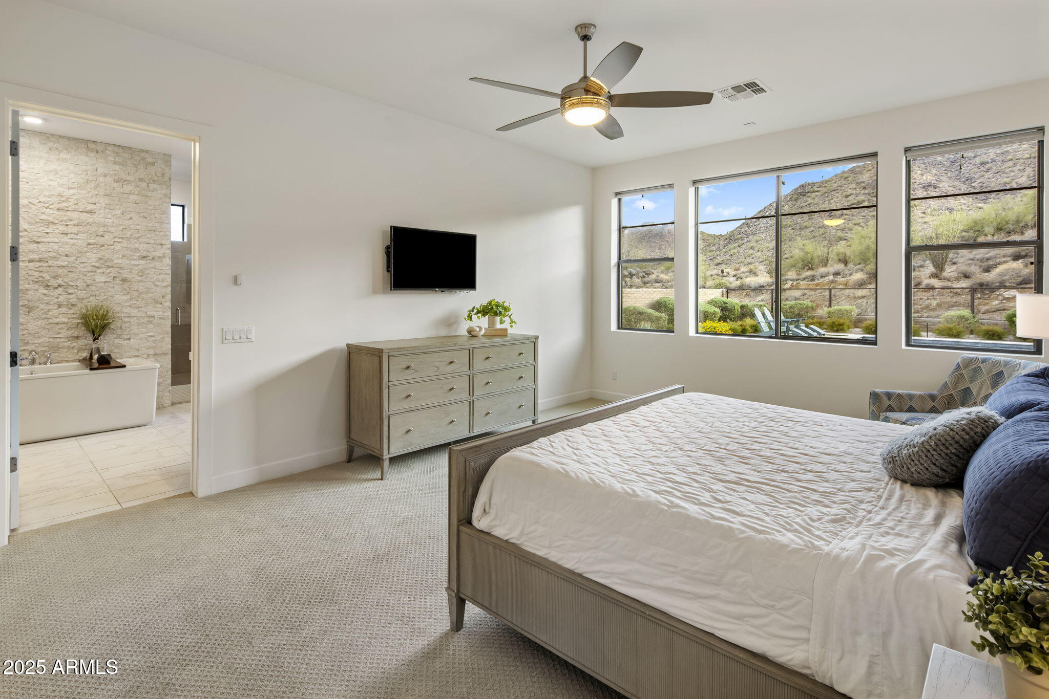 14122 Territory Trail Fountain Hills, AZ 85268 - Photo 5 of 46 a bedroom with a large bed and a tv