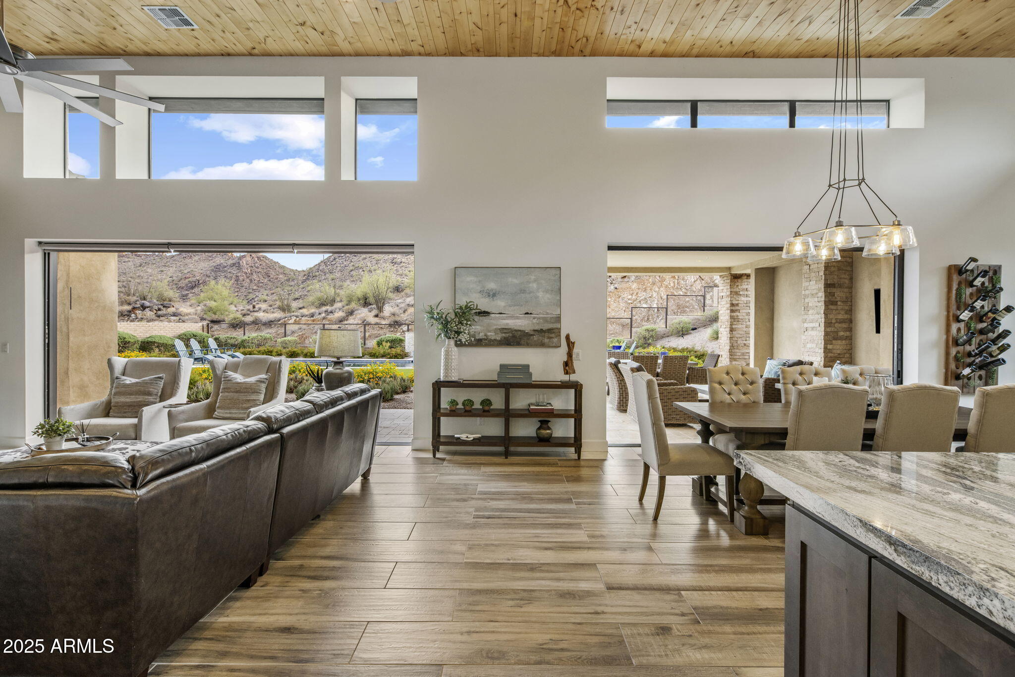 14122 Territory Trail Fountain Hills, AZ 85268 - Photo 10 of 46 a view of a dining room with furniture a chandelier and wooden floor