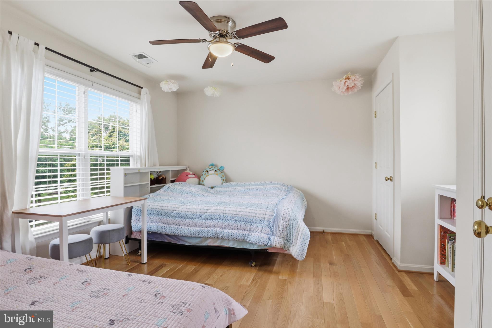 25352 Ripleys Field Drive Chantilly, VA 20152 - Photo 21 of 54 a bedroom with a bed and a large window
