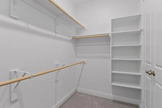 a view of an empty walk in closet