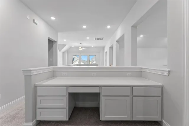 a kitchen with a sink dishwasher a stove and a refrigerator with wooden floor