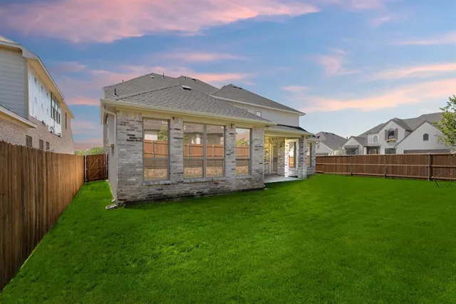 a view of a yard in front of a house with a yard