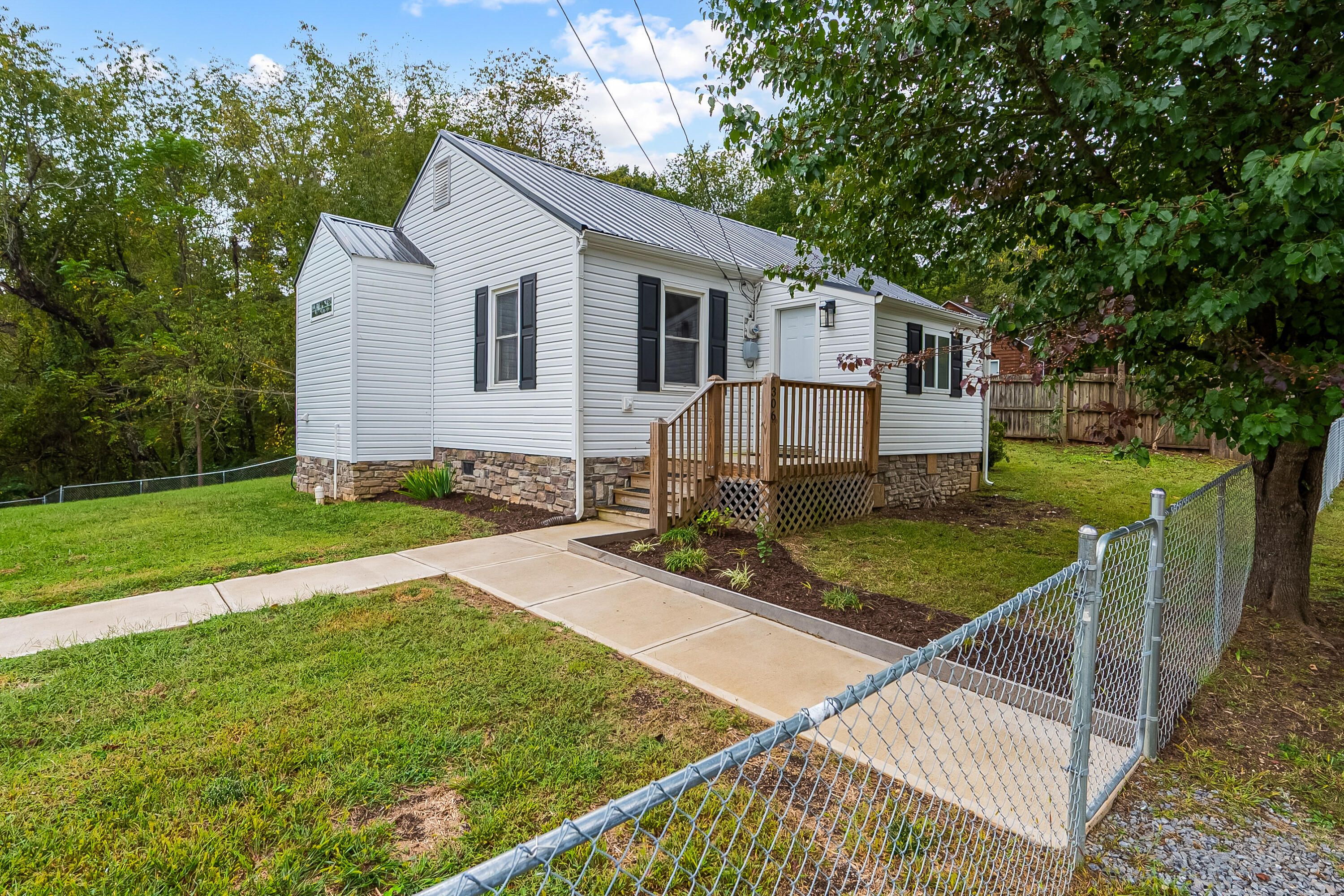 306 Lester Street Radford, VA 24141 - Photo 2 of 51 a view of a house with backyard and trees