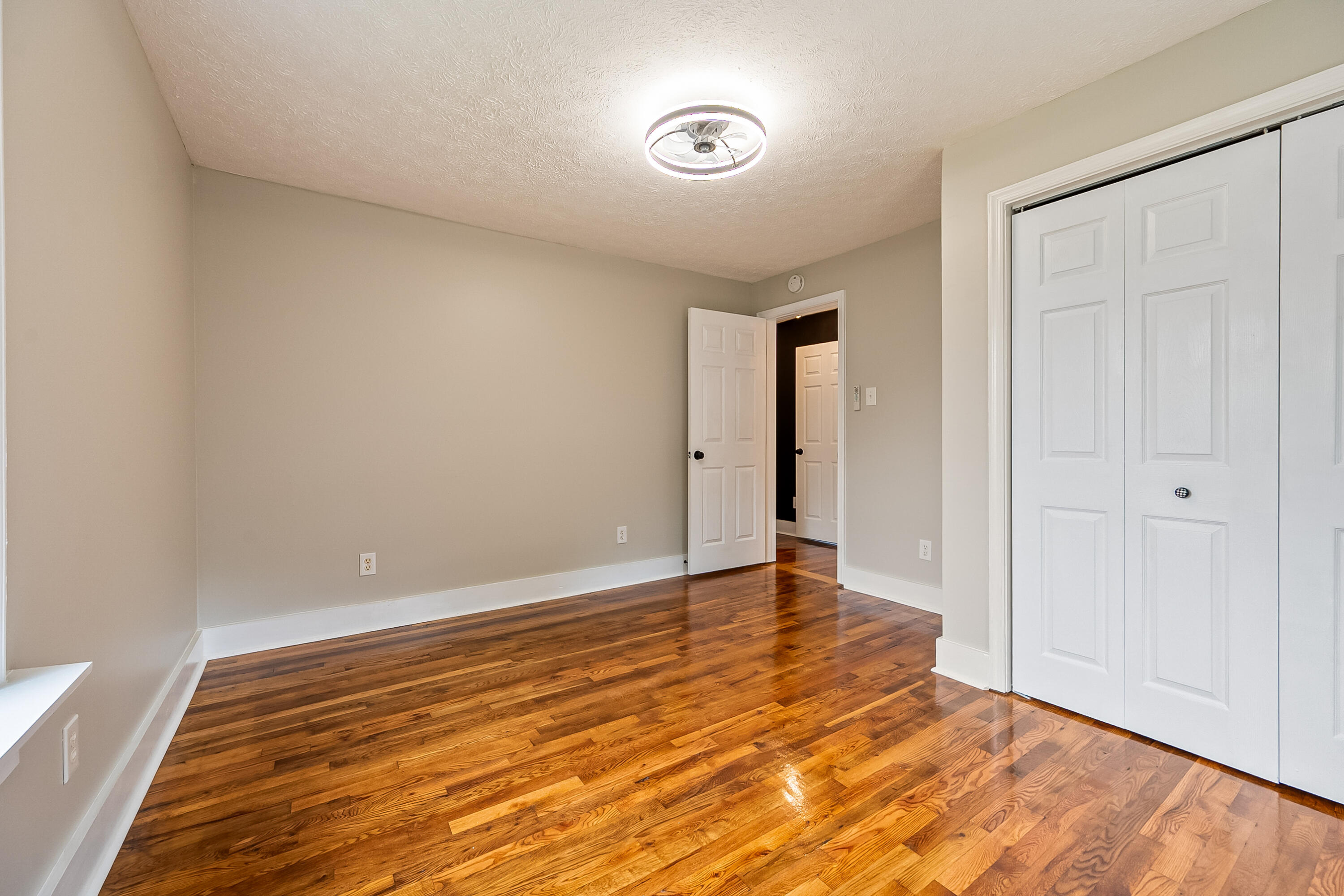 306 Lester Street Radford, VA 24141 - Photo 21 of 51 a view of an empty room and wooden floor