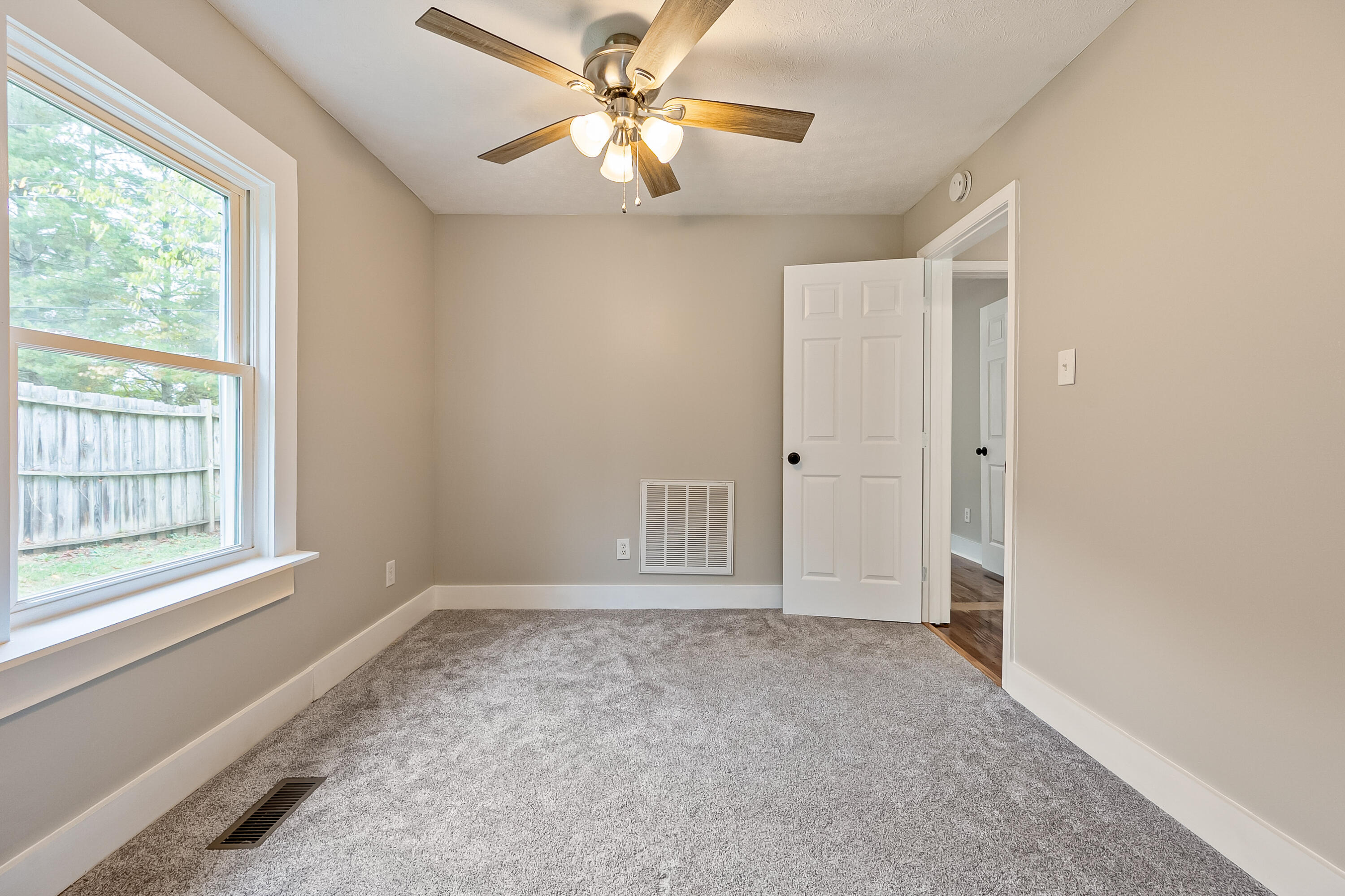 306 Lester Street Radford, VA 24141 - Photo 24 of 51 a view of an empty room with a window