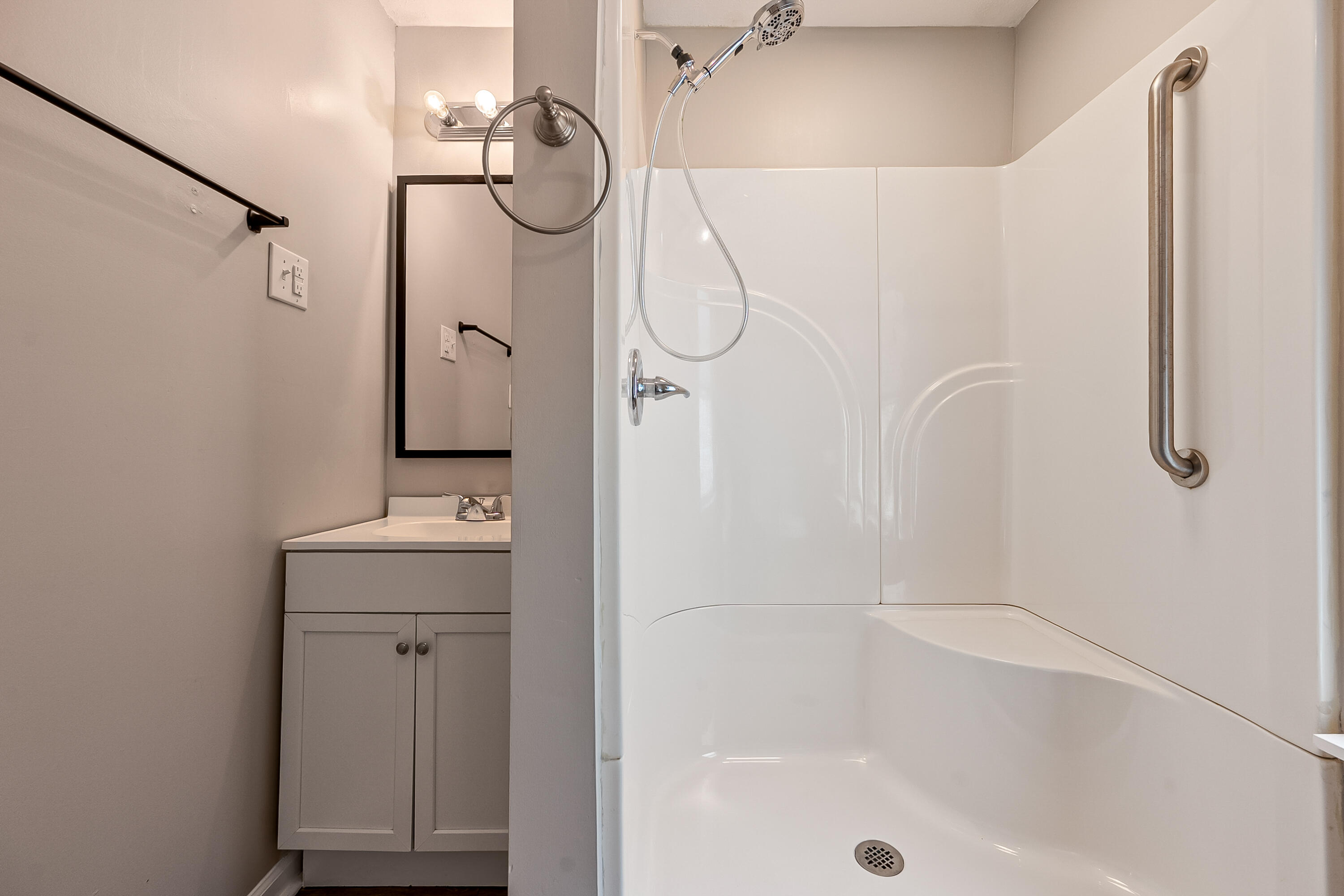 306 Lester Street Radford, VA 24141 - Photo 27 of 51 a bathroom with a shower a mirror and a shower