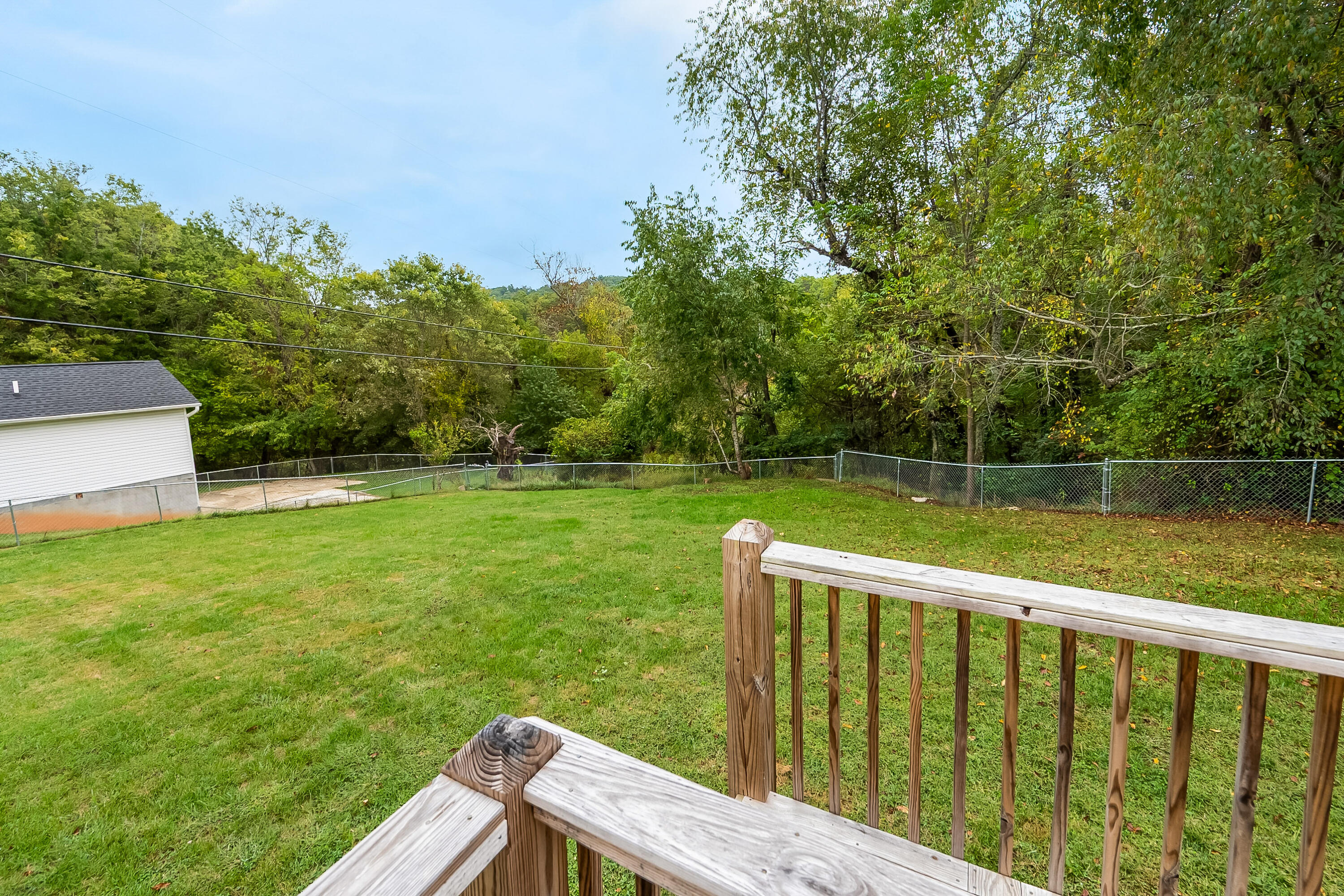 306 Lester Street Radford, VA 24141 - Photo 37 of 51 a view of a wooden deck and a yard