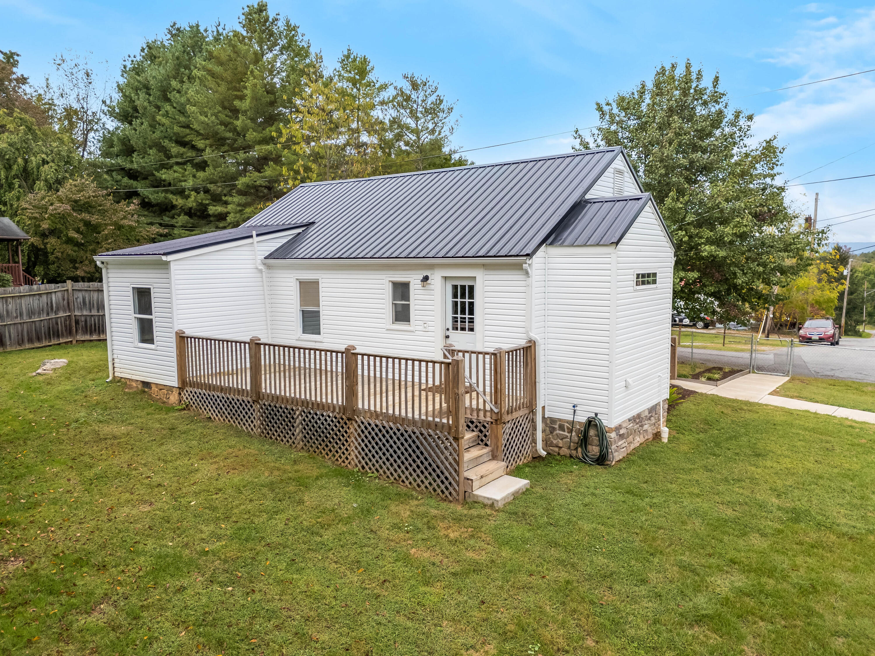 306 Lester Street Radford, VA 24141 - Photo 41 of 51 a view of a house with a yard and deck
