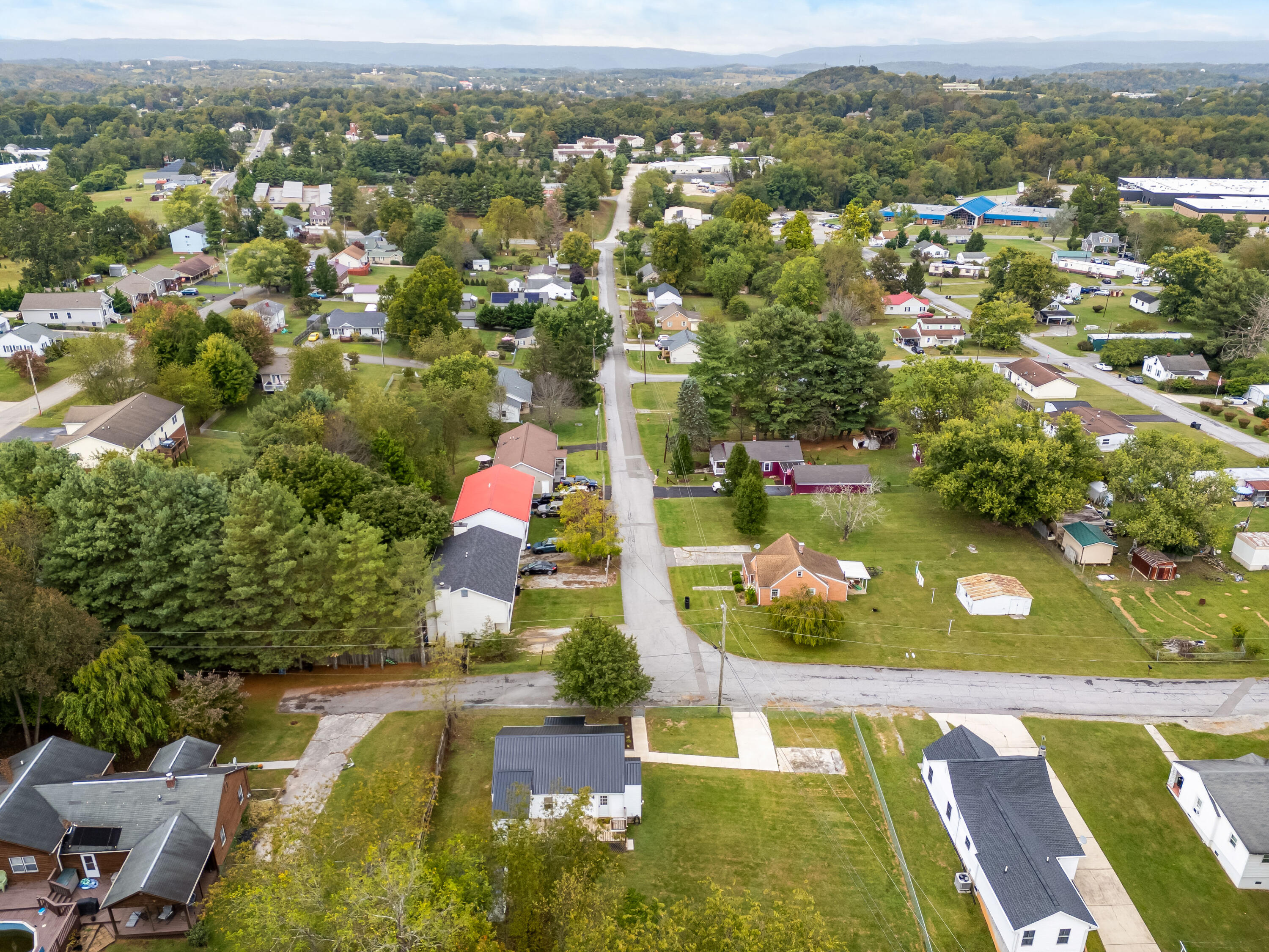 306 Lester Street Radford, VA 24141 - Photo 42 of 51 an aerial view of residential houses with outdoor space and swimming pool