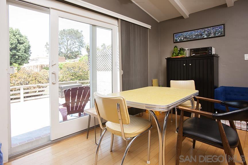 329 9th Street Del Mar, CA 92014 - Photo 12 of 29 a view of a dining room with furniture and wooden floor