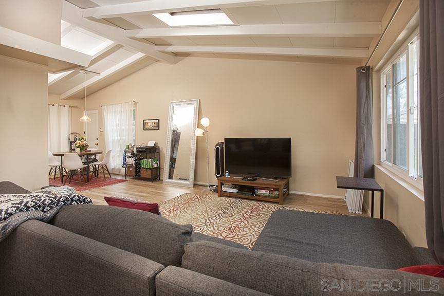 329 9th Street Del Mar, CA 92014 - Photo 19 of 29 a living room with furniture and a flat screen tv