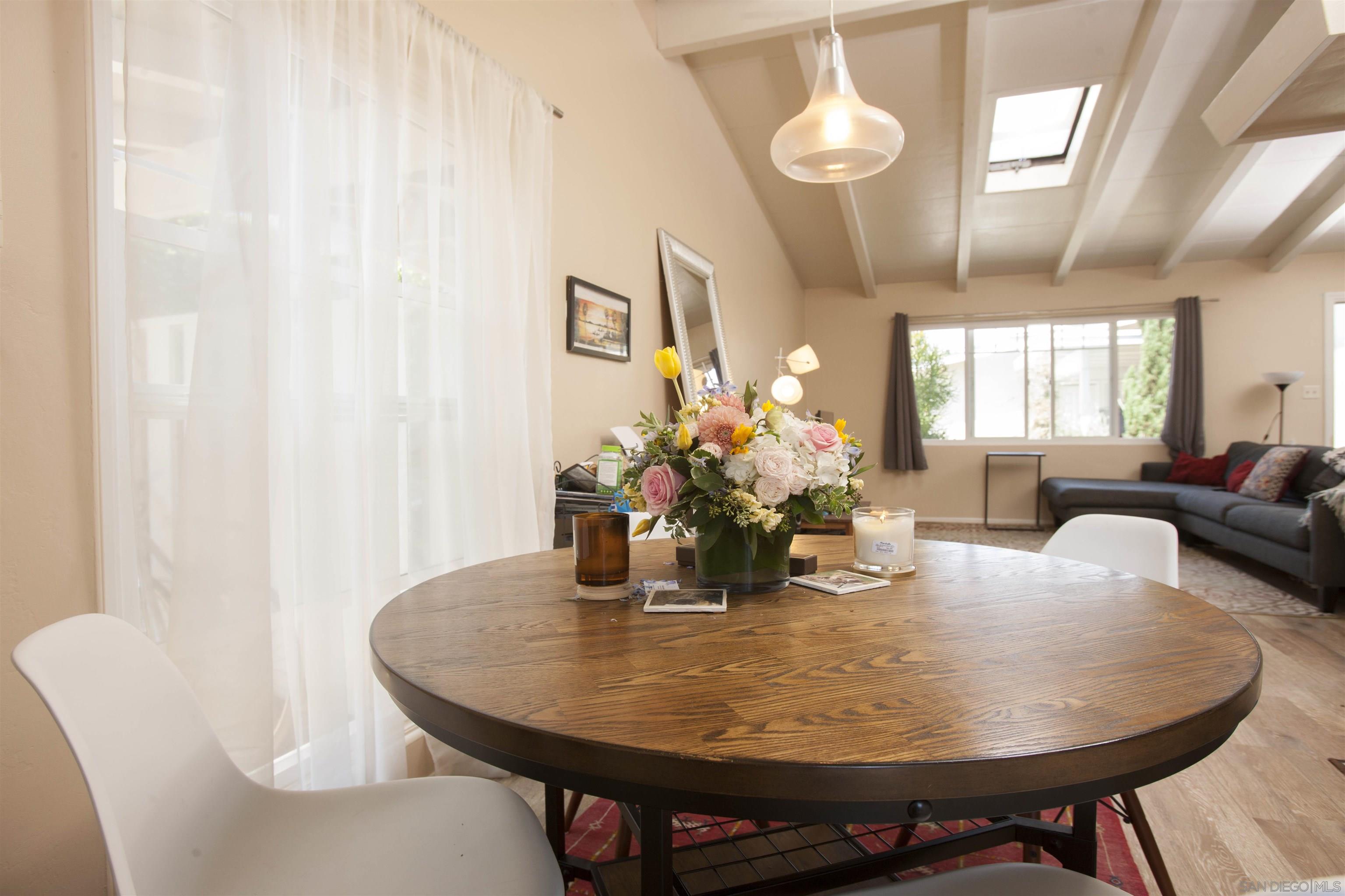 329 9th Street Del Mar, CA 92014 - Photo 21 of 29 a dining room with furniture and wooden floor