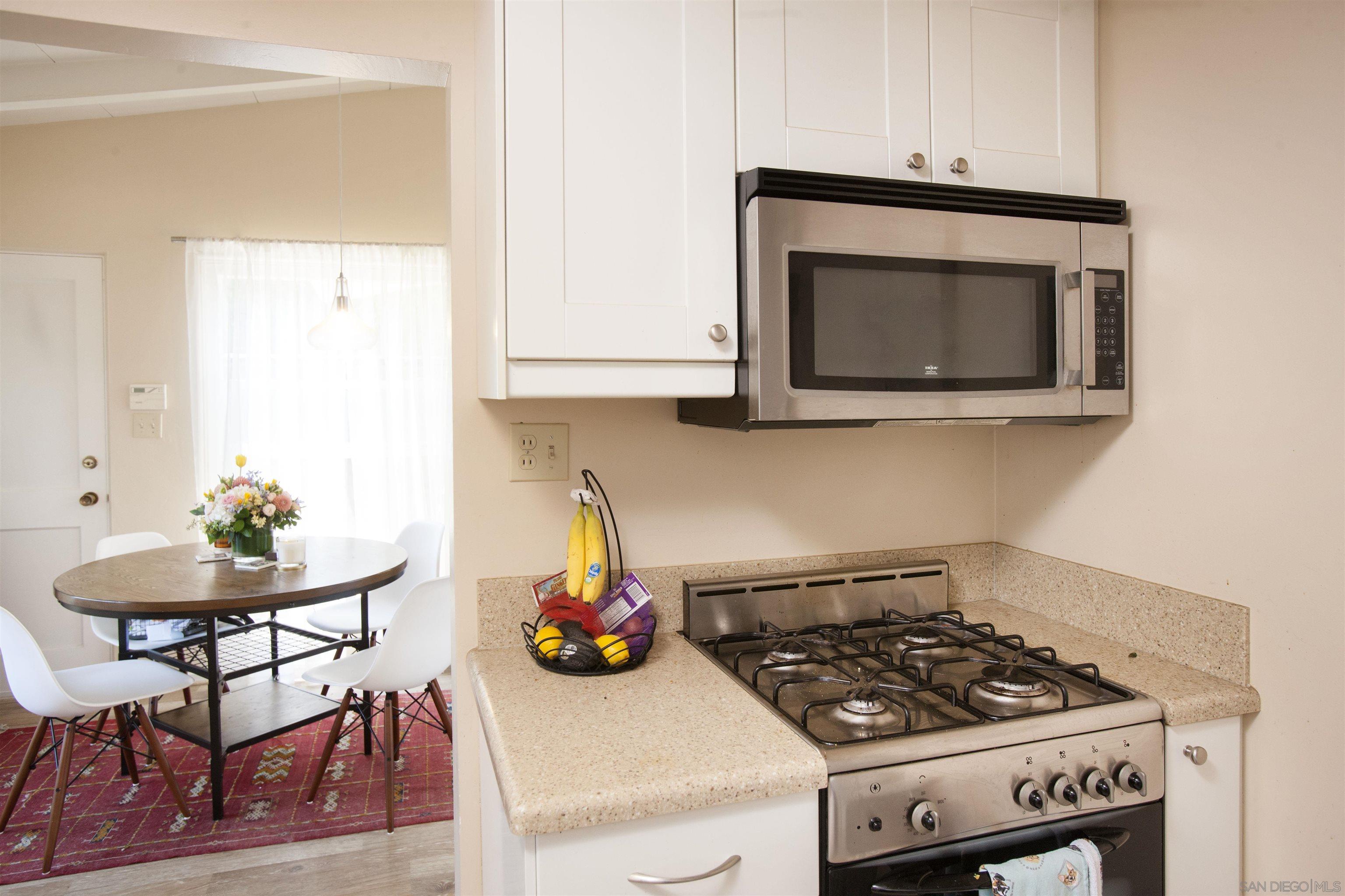 329 9th Street Del Mar, CA 92014 - Photo 24 of 29 a kitchen with a stove and a microwave