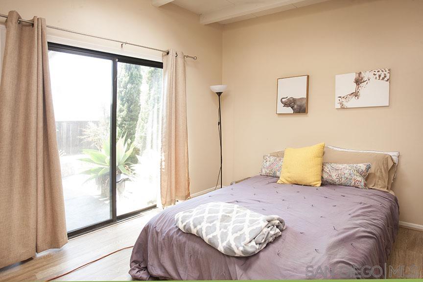 329 9th Street Del Mar, CA 92014 - Photo 26 of 29 a bedroom with a large bed and a window