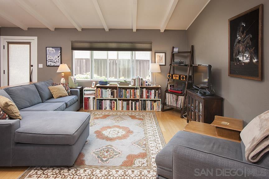 329 9th Street Del Mar, CA 92014 - Photo 8 of 29 a living room with furniture a flat screen tv and a large window