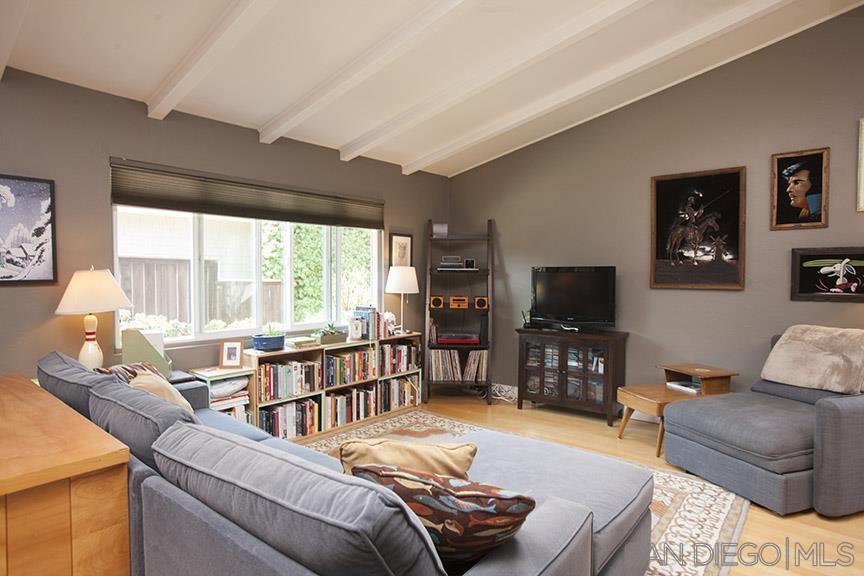 329 9th Street Del Mar, CA 92014 - Photo 9 of 29 a living room with furniture and a flat screen tv