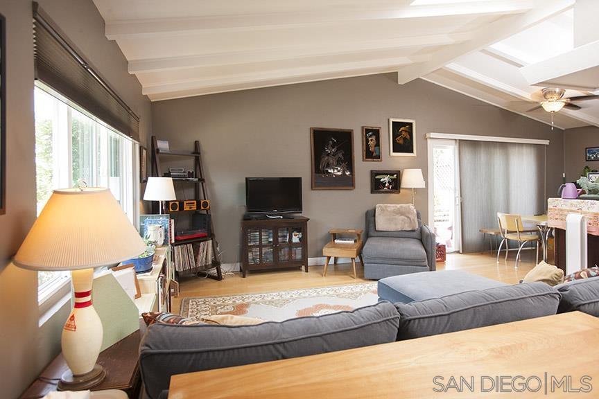 329 9th Street Del Mar, CA 92014 - Photo 10 of 29 a living room with furniture and a flat screen tv