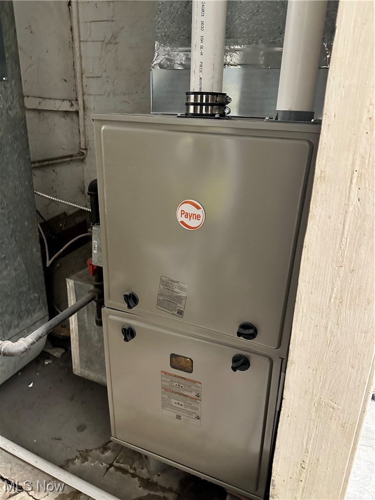 453 Lawn Street Geneva, OH 44041 - Photo 15 of 26 Utility room with heating unit