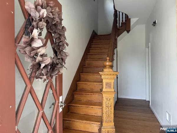 a view of entryway with wooden floor