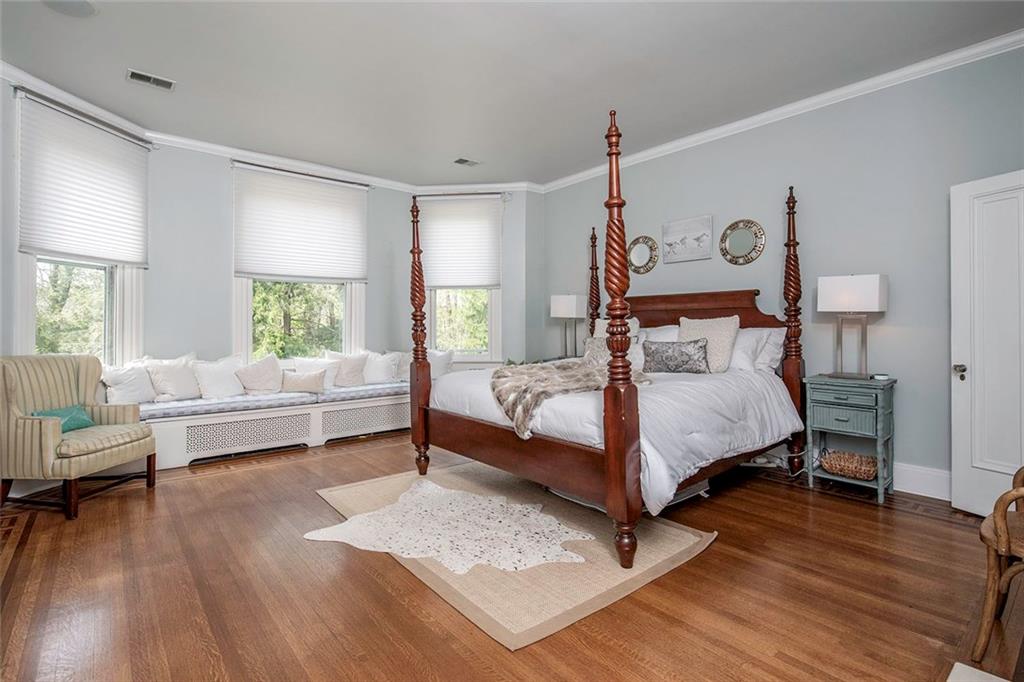404 Beaver Road Sewickley, PA 15143 - Photo 13 of 24 Spacious and bright master bedroom with built in cabinets and fireplace.