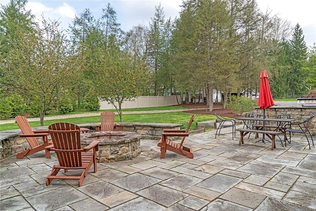 404 Beaver Road Sewickley, PA 15143 - Photo 18 of 24 Side patio outside firepit and dining area.