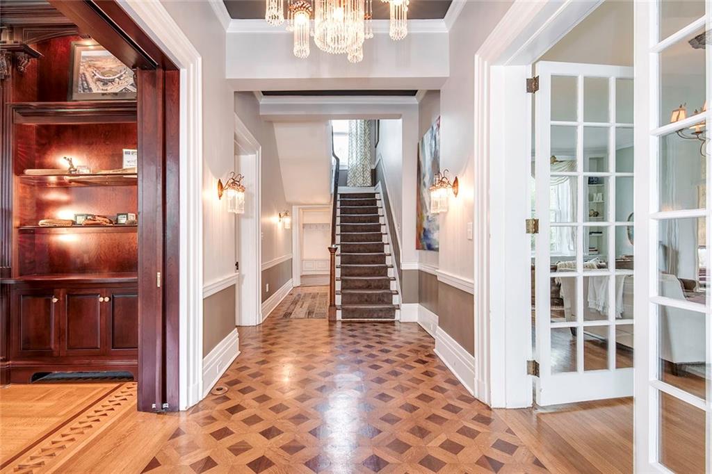 404 Beaver Road Sewickley, PA 15143 - Photo 2 of 24 Spectacular entry/foyer showcasing 12+ foot ceilings and detailed hardwood floors throughout.