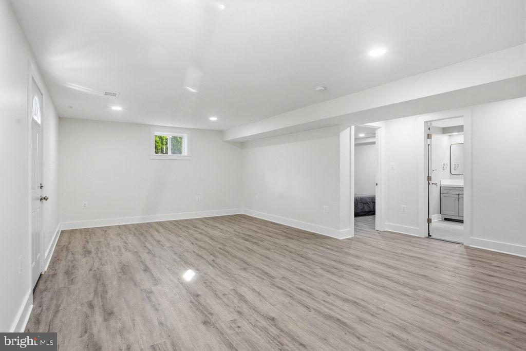 6620 Napoli Road Temple Hills, MD 20748 - Photo 27 of 38 a view of an empty room with wooden floor