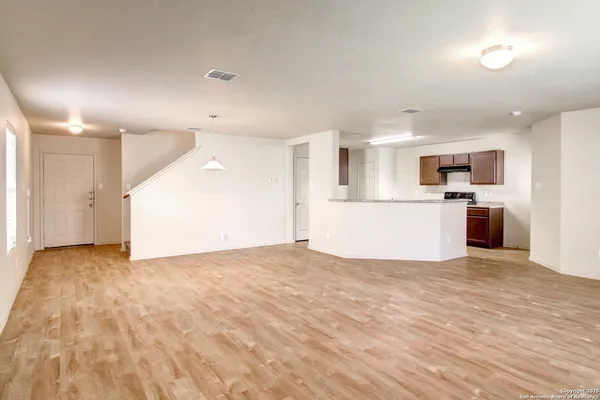 a view of a kitchen with a sink and a stove top oven