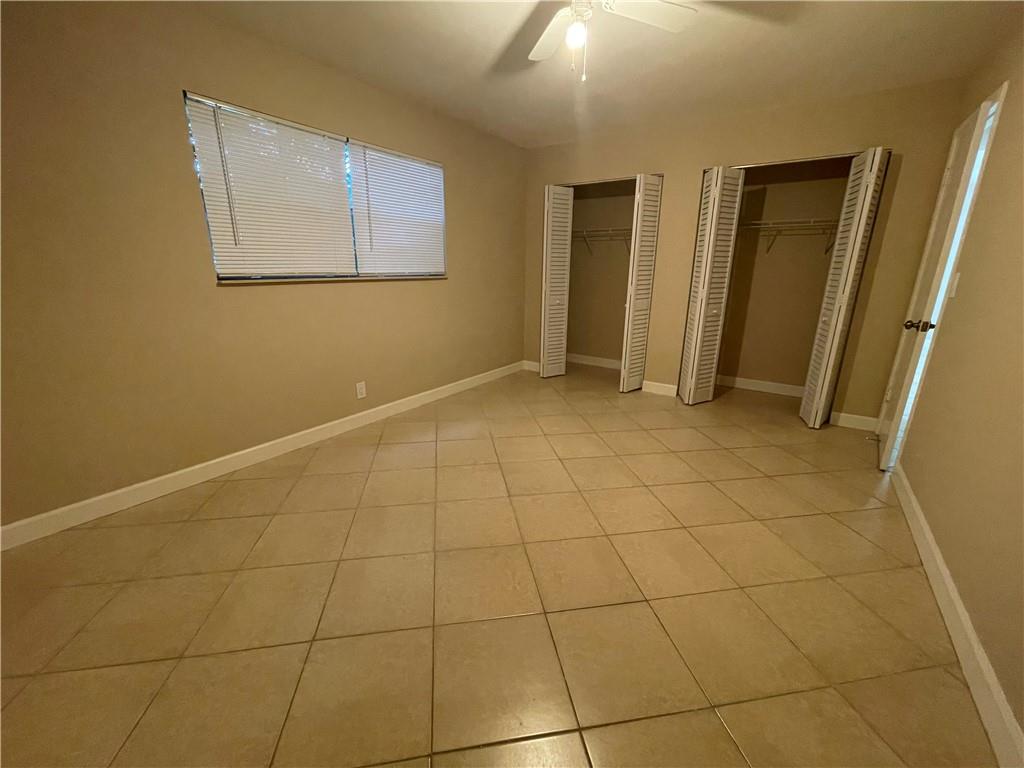 550 Southeast 2nd Avenue, Unit G5 Deerfield Beach, FL 33441 - Photo 11 of 28 a view of a livingroom with an empty space and a window